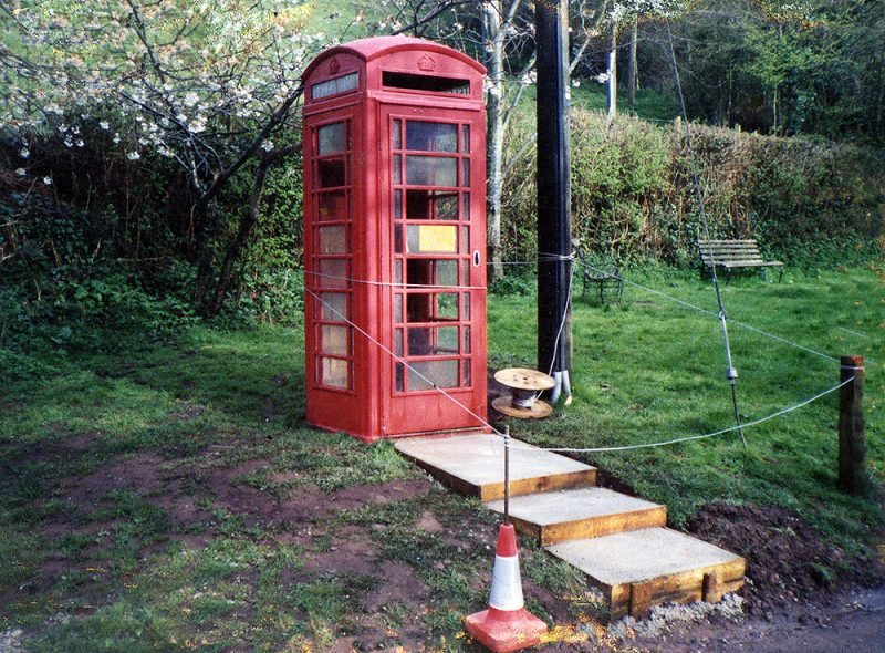 The phone box replacement with new concrete steps being installed