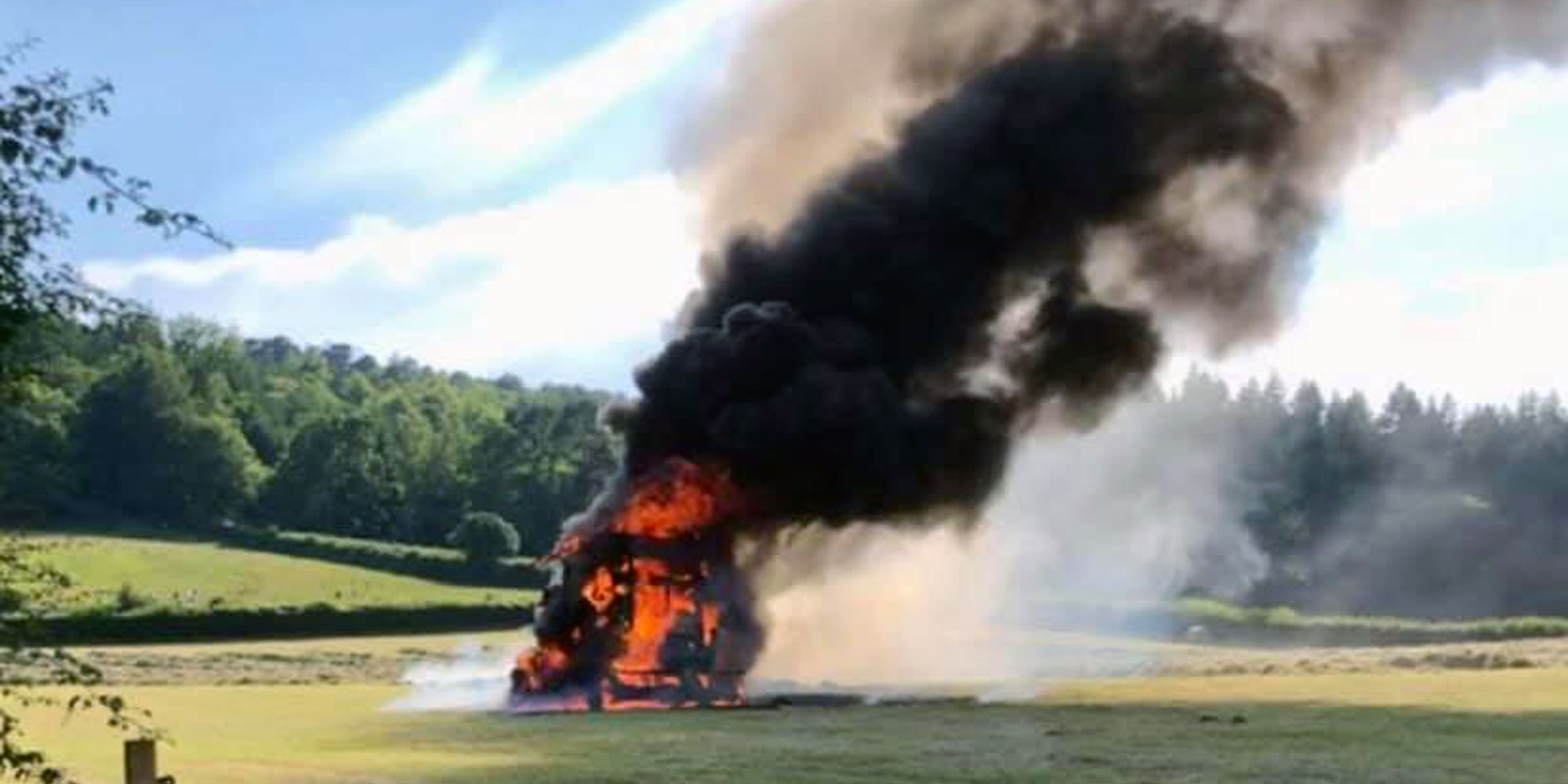 Hay baler on fire in Luccombe