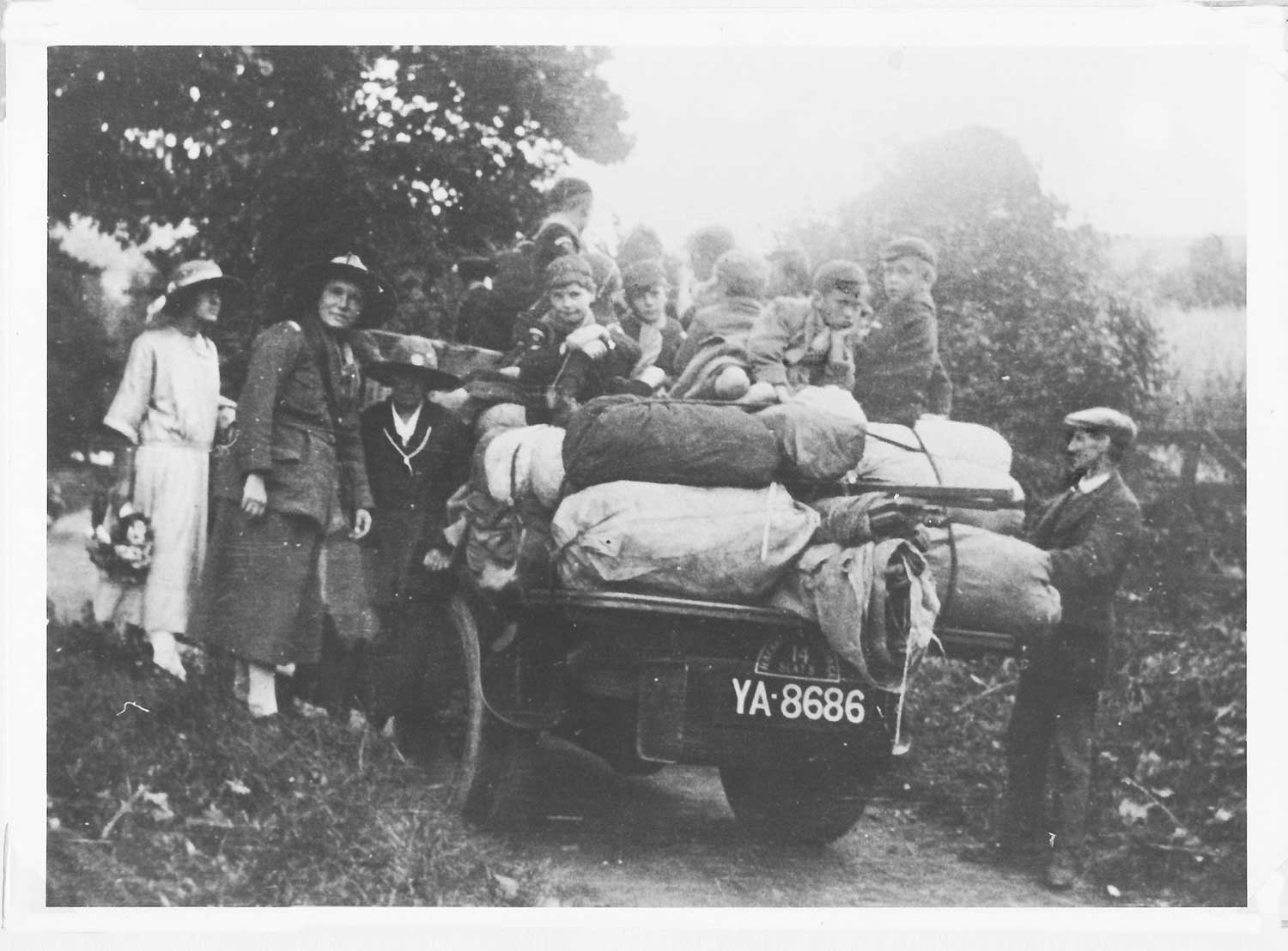 Bill Prescott and his lorry/char-a-banc with a party of boy scouts and their camping gear in Huish Ball Lane.